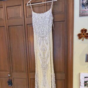 Sherri Hill Prom Dress Style #52454 Pale Yellow Beaded Gown with Beaded Tassles